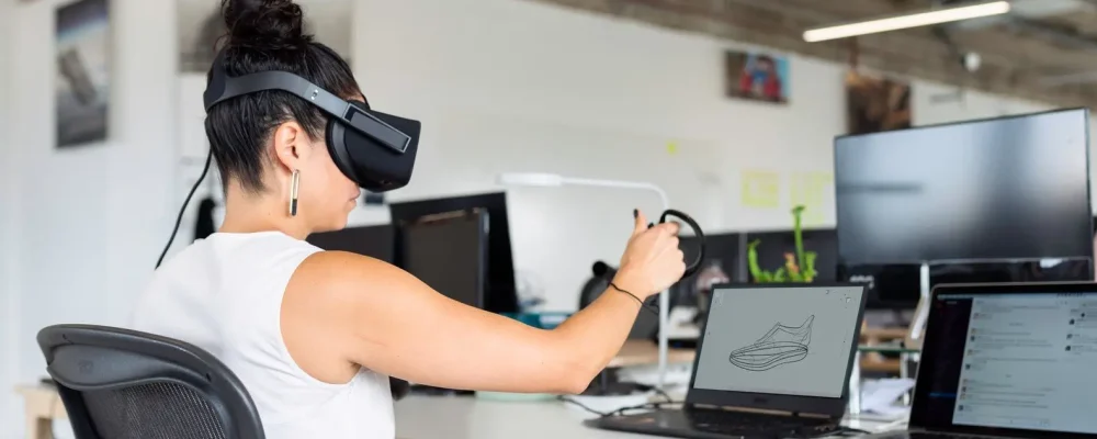 woman-in-white-tank-top-using-black-laptop-computer-with-vr-3861458.jpg